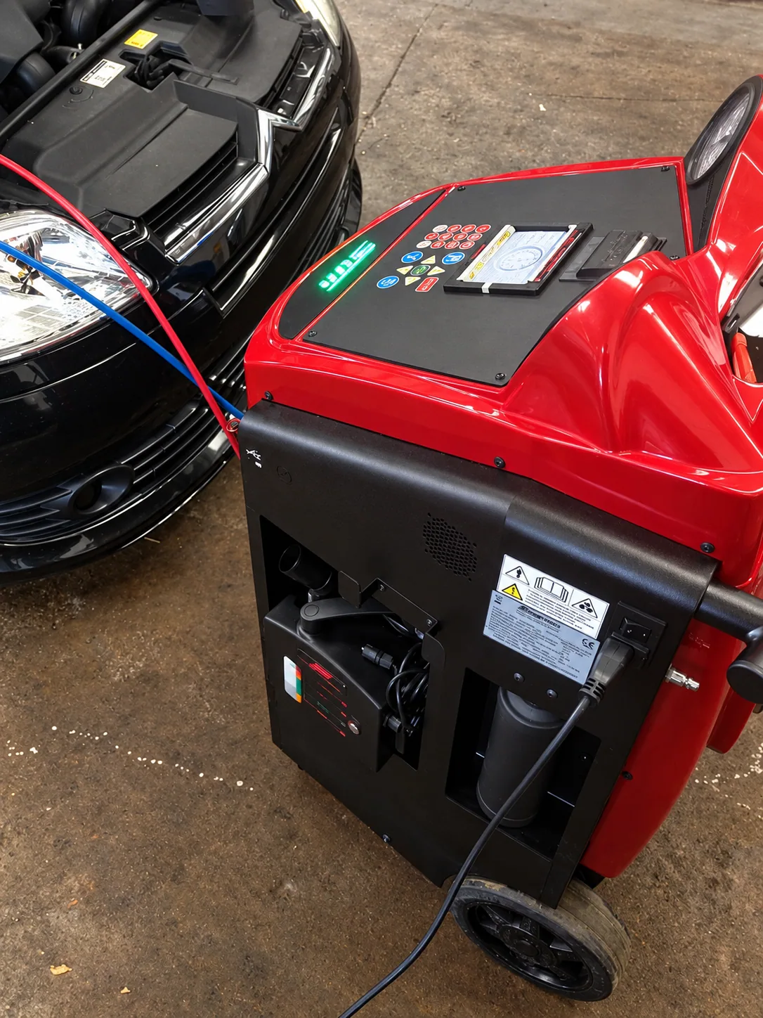 Air-conditioning regas machine connected to a car at Norwich Garage