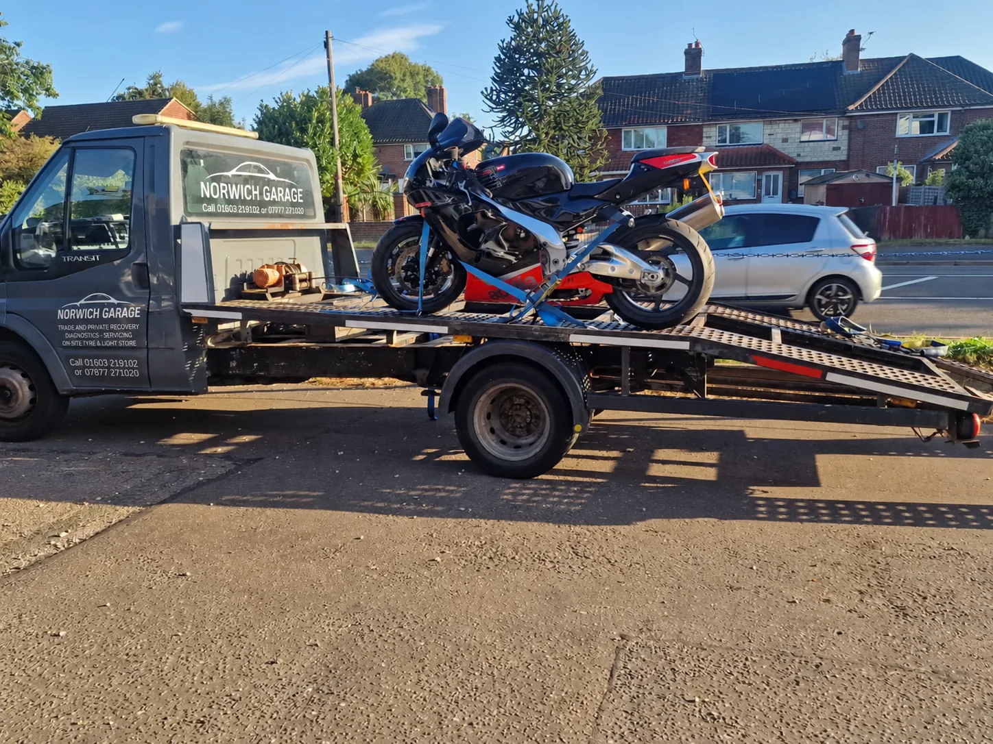 Motorcycle secured to a recovery truck