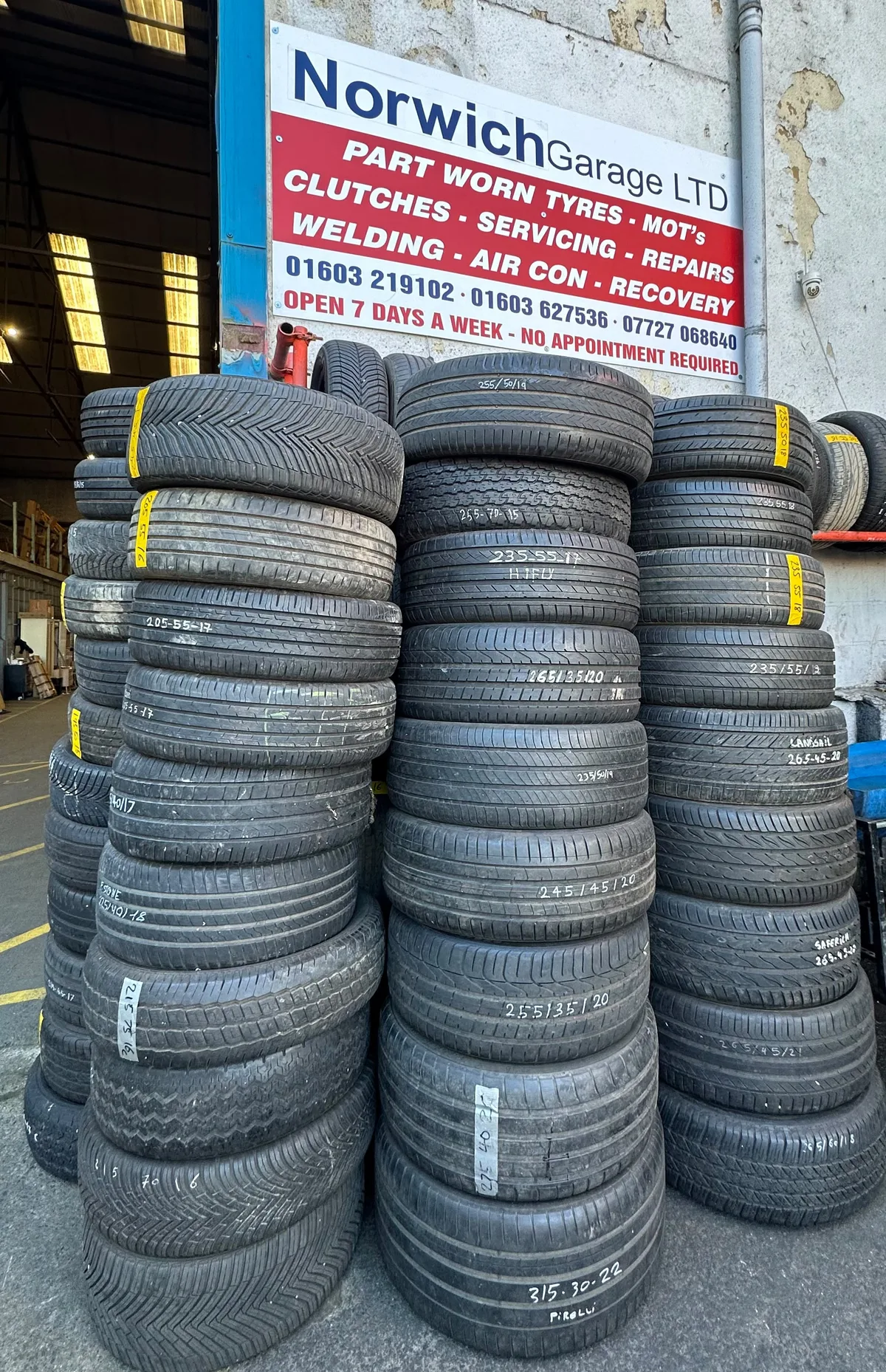 Stacks of part-worn tyres outside Norwich Garage